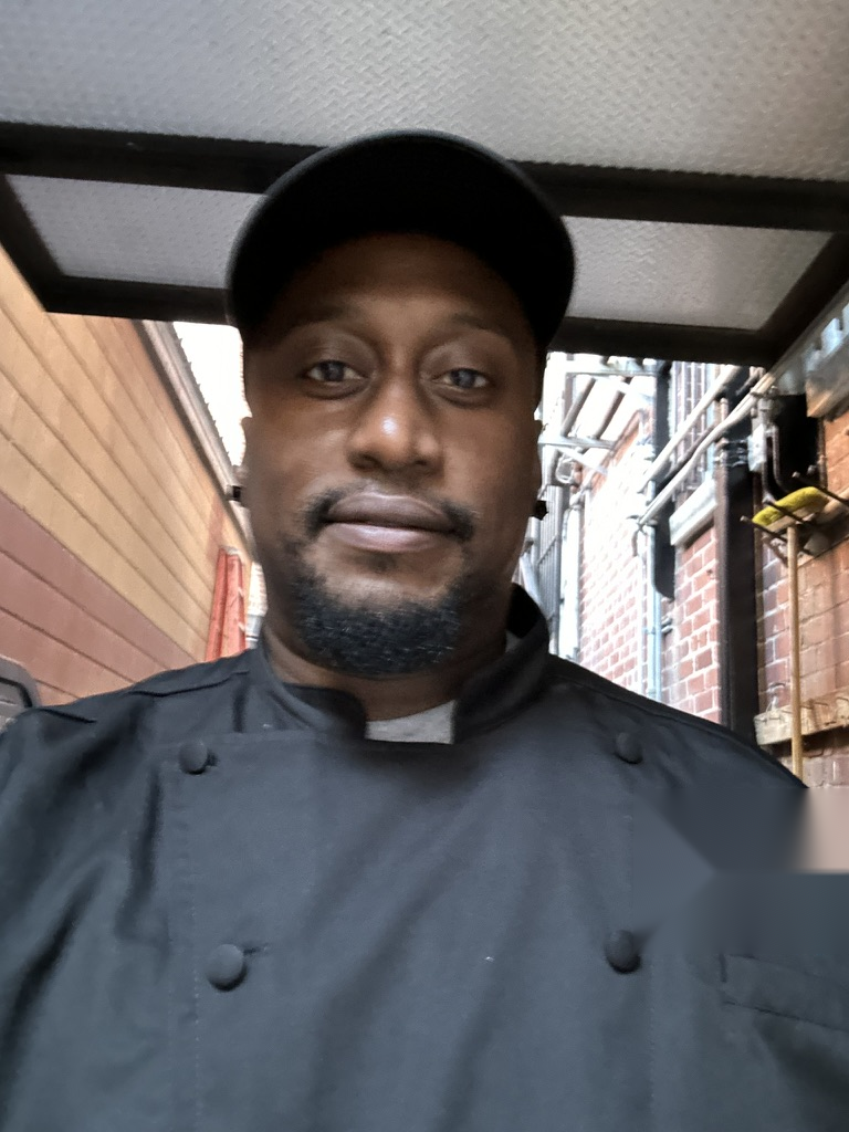 Portrait of the Big Belly Athletics founder in a chef coat
