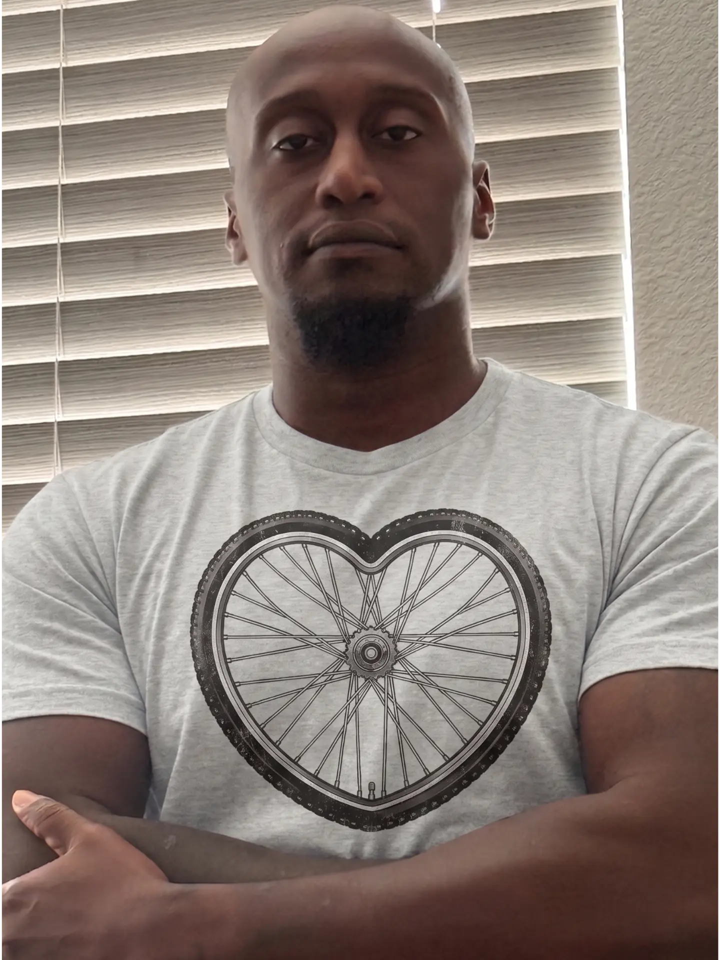 Founder in the Bike Love heart-wheel tee